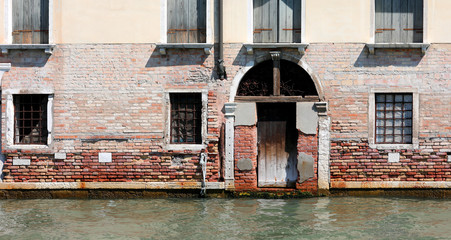 palace with gate and high water during high tide in Venice