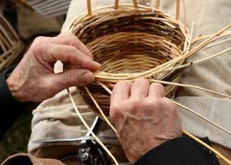 gnarled hands of the elderly artisan worker