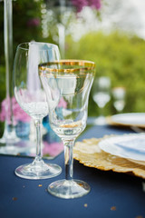 Wine glasses and champagne flutes on table, Wedding decor. Selective focus
