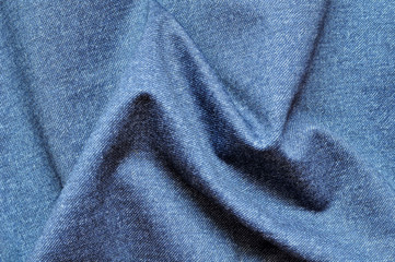 Fototapeta na wymiar Folds of gray dense woolen fabric.