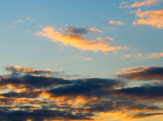 Naklejka na ściany i meble Bottom aligned sunset clouds background