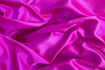 Textile  background. Pink  silk. Top view. Copy space. Closeup.