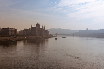 Fototapeta premium Parliament building and Danube river in the foggy morning, Budapest, Hungary.