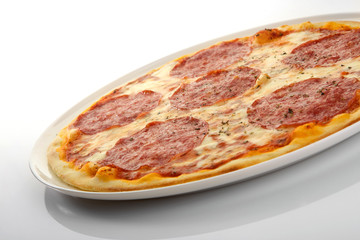 Flatlay of Italian pizza on wooden background. Rustic homemade pizzas with salami, bacon,  cheese, eggs and raw vegetables on shabby wooden background. Healthy vegetarian fungi pizza