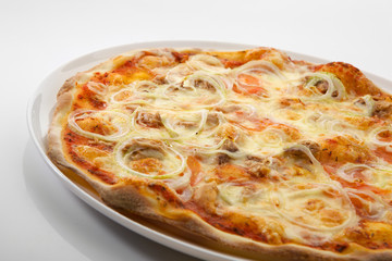 Flatlay of Italian pizza on wooden background. Rustic homemade pizzas with salami, bacon,  cheese, eggs and raw vegetables on shabby wooden background. Healthy vegetarian fungi pizza