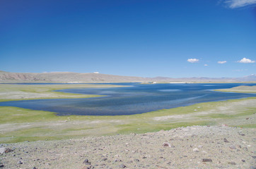 Mongolian Altai. Khurgan Lake lies at the foot of the Altai Mountains near the Chinese border. Height about 2000 m above sea level. Nature and travel. Mongolia, Bayan-Olgii Province, Altai Tavan Bogd 