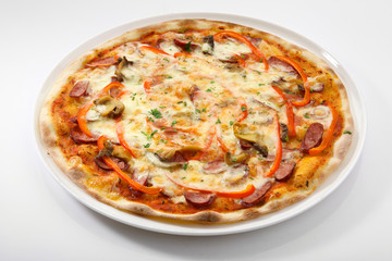 Flatlay of Italian pizza on wooden background. Rustic homemade pizzas with salami, bacon,  cheese, eggs and raw vegetables on shabby wooden background. Healthy vegetarian fungi pizza