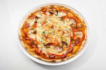 Flatlay of Italian pizza on wooden background. Rustic homemade pizzas with salami, bacon,  cheese, eggs and raw vegetables on shabby wooden background. Healthy vegetarian fungi pizza