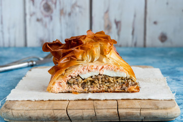 Coulibiac - Russian type of pirog filled with salmon stuffed with rice, mushrooms,onion,dill and hard-boiled egg - obrazy, fototapety, plakaty