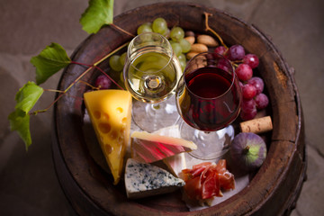 Glasses of red and white wine in wine cellar. Overhead, top view image