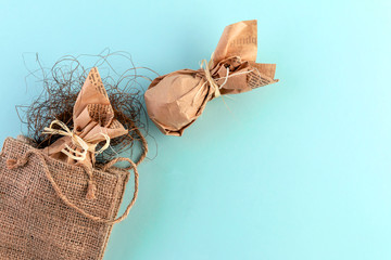 Easter flat layout of burlap, eggs in craft paper. The concept of eco-friendly minimalistic consumption of gifts. Close-up