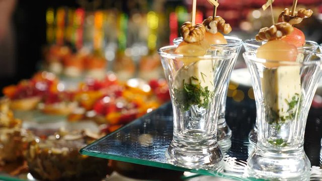 Restaurant chef serving. Close-up of chef hands decorating catering banquet table with canape in hotel. catering service buffet food set in event celebration, corporate or birthday party or wedding. 4