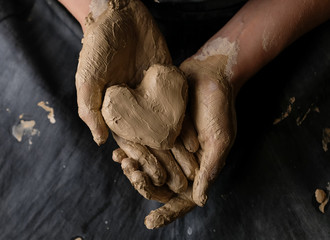 The master works behind the potter's wheel