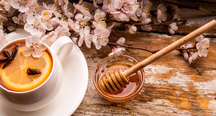 cup of tea with lemon and mint on a wooden background. selective focus. immunity. flu. treatment....