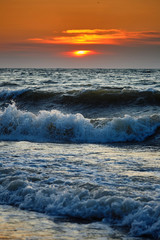 Sea waves and Beautiful dawn sunrise at sea. Seascape.