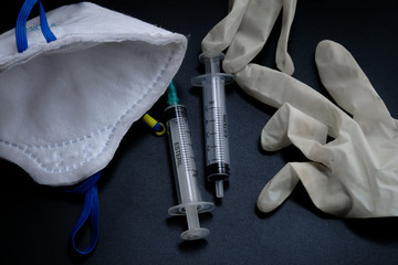 A small syringe into which a hollow, sharp-pointed bevel-cut needle is inserted and is used to inject medicinal substances into tissues or organs.