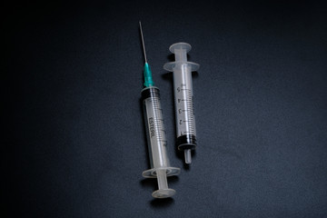 A small syringe into which a hollow, sharp-pointed bevel-cut needle is inserted and is used to inject medicinal substances into tissues or organs.