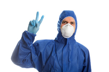 Doctor in protective clothing showing V victory. Everything will be O.K.