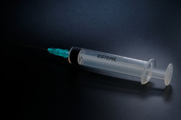 A small syringe into which a hollow, sharp-pointed bevel-cut needle is inserted and is used to inject medicinal substances into tissues or organs.