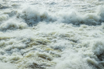Splashing water waves on the spring fast river