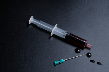 A small syringe into which a hollow, sharp-pointed bevel-cut needle is inserted and is used to...