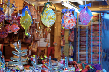 Fototapeta premium Christmas tree decorations displayed for sale at the Christmas market