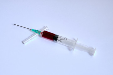 A small syringe into which a hollow, sharp-pointed bevel-cut needle is inserted and is used to...