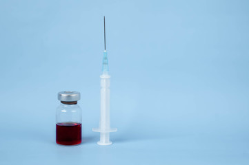 syringe and ampoule with medicine against coronavirus.COVID-2019