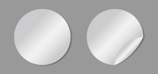 Vector white realistic round paper adhesive stickers with curved corner on gray background.