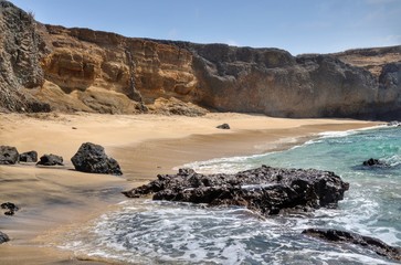 Se boulders on the white sand beach ion Djeu