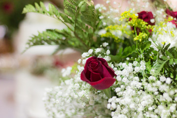 wedding rings on a bouquet of roses