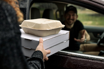 Crisis: Woman Server Delivers Curbside During Social Distancing