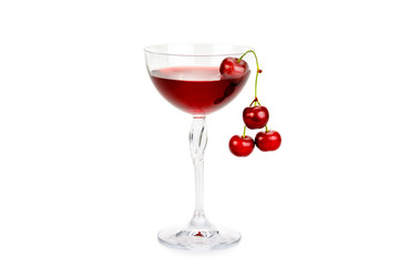 Cherry juice and berries isolated on white background.