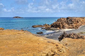 Fototapeta na wymiar Cliff and beaches found on the islet of Djeu, in the archipelago of Cabo Verde