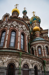 Fototapeta na wymiar Ornate exterior and colorful domes of the Church of the Savior on Spilled Blood or Cathedral of Resurrection of Christ, Saint Petersburg, Russia 