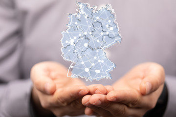 a virtual germany land  map digital in hand 3d
