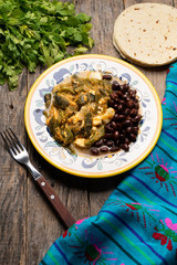 Mexican poblano pepper rajas and panela cheese on wooden background