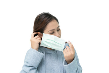 Girl wearing mask again flu and covid-19,corona virus by putting right ear hook