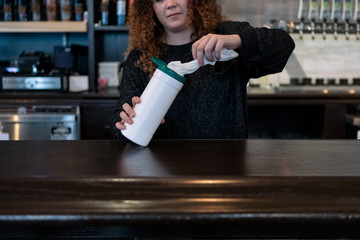 Crisis: Bartender Pull Out Wipe To Sanitize Bartop