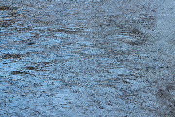 Water surface with waves and glare of light. Place for text and design