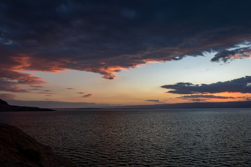 Fototapeta na wymiar Colorful dramatic sky at sunset at Dead Sea as seen from Eastern coast, Middle East, Kingdom of Jordan