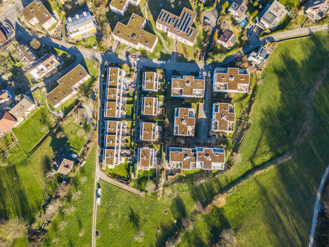 Aerial view of building at border of a town. Concept of urban sprawl in suburban area in Switzerland.