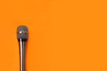 music microphone on an orange background