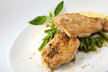 Appetizing stake with vegetables isolated on white background. Grilled meat