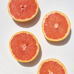 Grapefruit rich in vitamin c on white background
