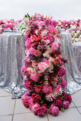 Pink peonies and other flowers decoration on a festive table