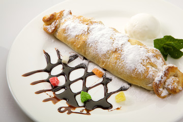 Strudel isolated on white background. Apple pie
