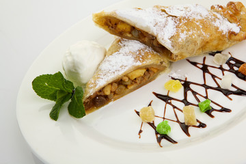 Strudel isolated on white background. Apple pie