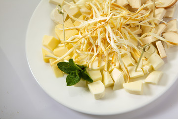Assortment of cheese isolated on white background. Beer cheese plate