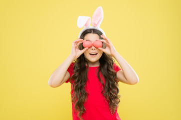 Happy girl. Bunny celebrate Easter. Keep day holy when Masses are cancelled. Spring holiday activities. Quarantined Sunday. Fun and educational Easter activity for kids. Little girl easter eggs